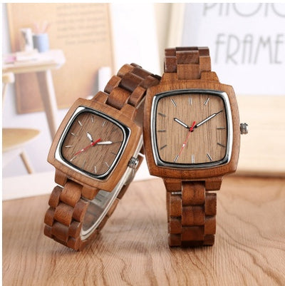 Two wooden watches with square faces and wooden link bands, designed for couples.