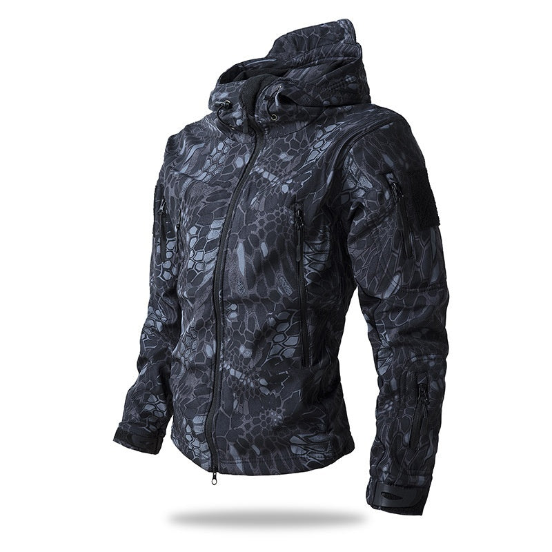 A men's waterproof tactical jacket with a distinctive gray digital camouflage pattern, a hood, and multiple zippered pockets.