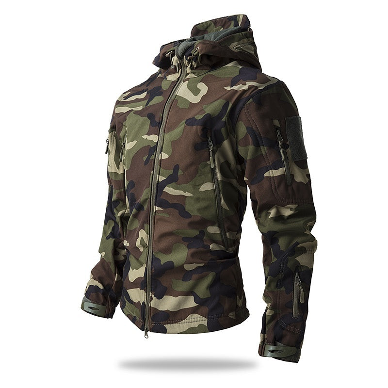 A men's waterproof tactical jacket in a classic woodland camouflage pattern, featuring a hood and multiple zippered pockets.