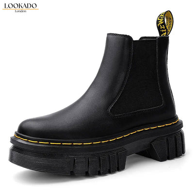 Stylish black platform Chelsea boots for women with a chunky sole and classic design.