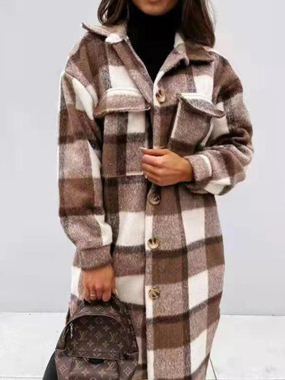 Woman wearing a brown and white plaid coat with a button front and two chest pockets.