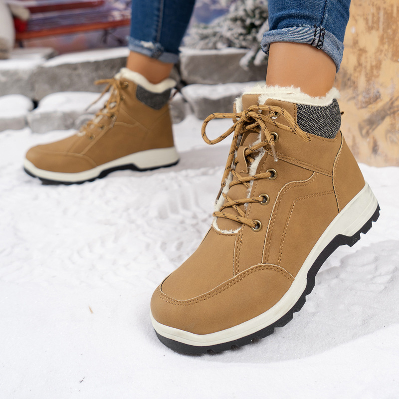 Tan lace-up winter boots for women with warm lining, perfect for snowy weather.