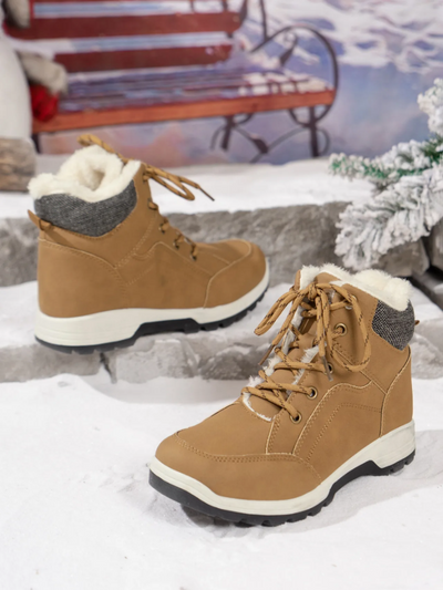 Pair of tan waterproof winter boots for women with warm fur lining.