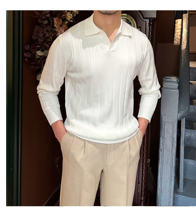 front view of a men's white knit sweater with a collared neckline and ribbed detailing, styled with beige trousers.