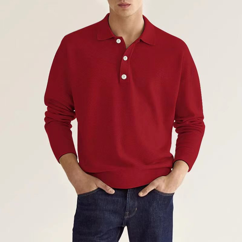 A man in a vibrant red polo sweater styled with jeans.