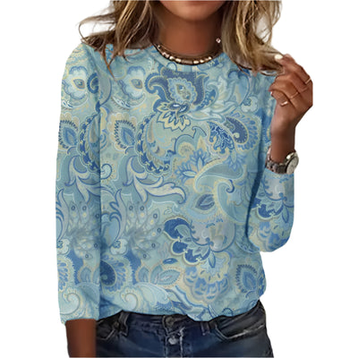 A long-sleeve women's top with a pastel blue floral paisley pattern.