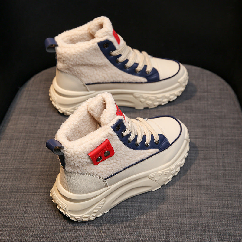 Women's high-top white sneakers with red and blue trim, featuring a cozy fleece lining for added comfort.